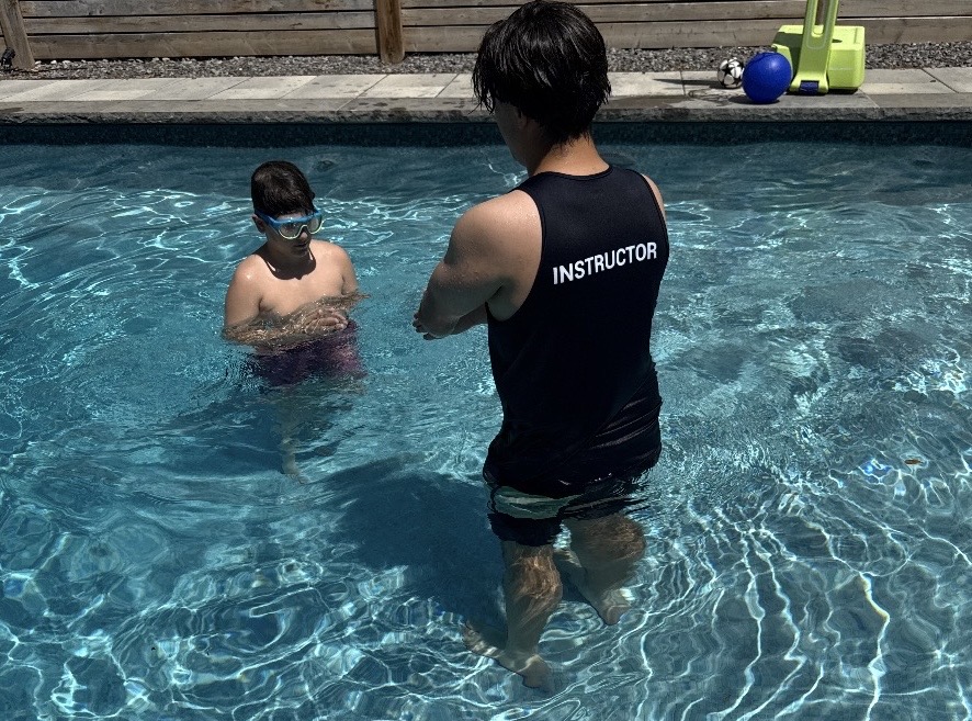 Swim Next Door instructor and swimmer